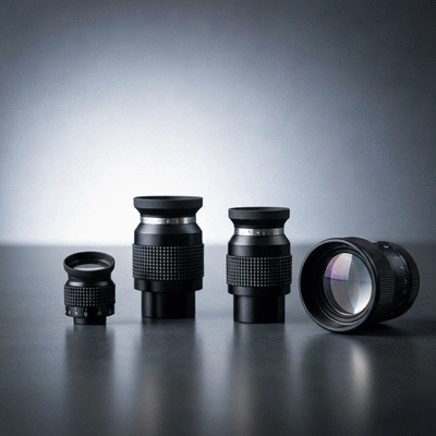 Assorted high-quality telescope eyepieces and lenses on a dark table